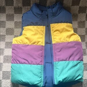 Gap Reversible Colorblock Puffer Vest in Blue, Yellow, Purple, and Teal